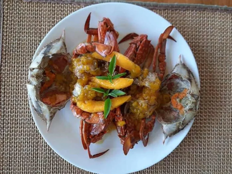 A plate of crab and prawns in butter and garlic