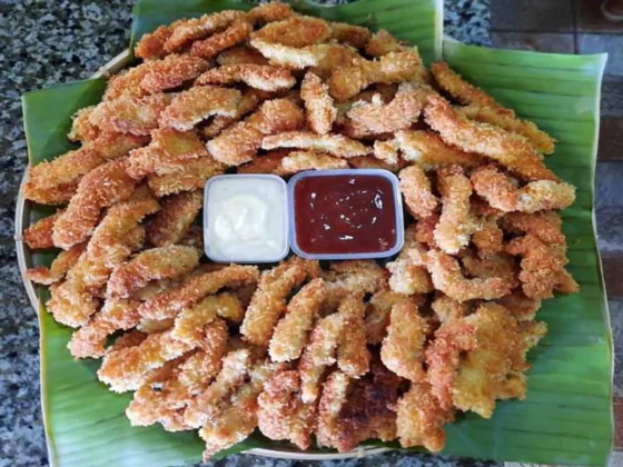 A plate of fried calamares with dipping sauces