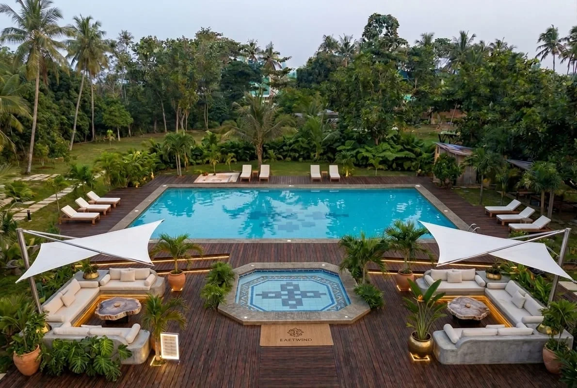 The pool deck and event lawn seen from above at dusk