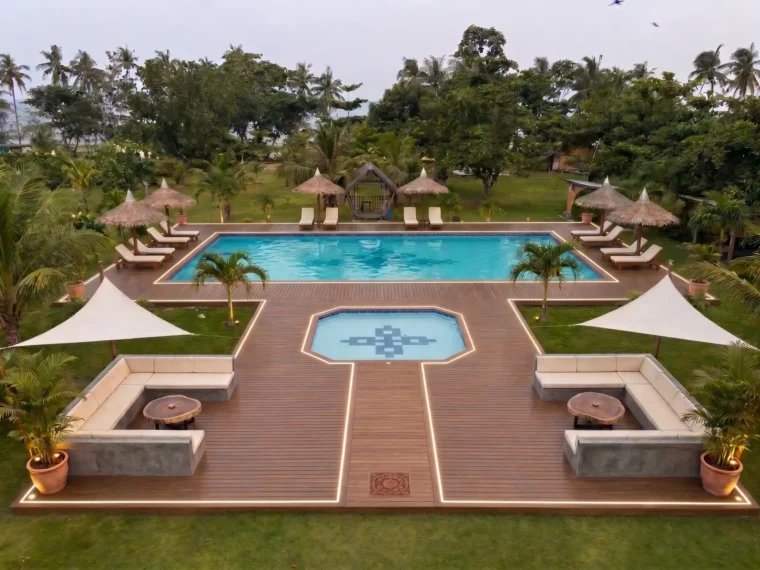 The pool deck at twilight with lit deck edges
